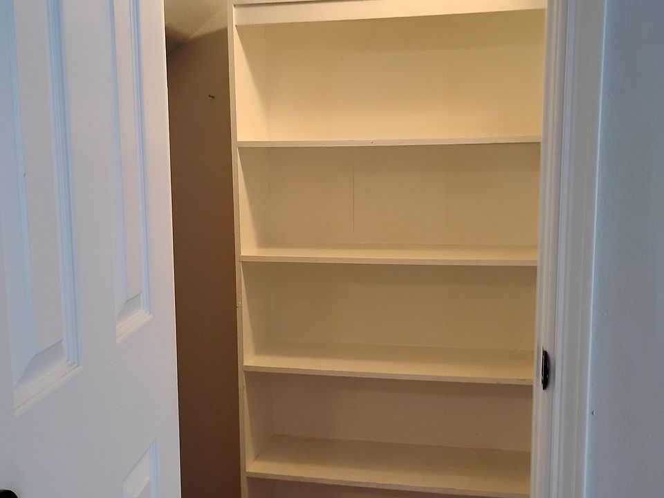 Under the staircase large closet.