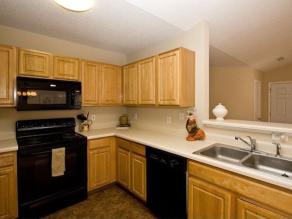 Cute kitchen includes ample counter space.