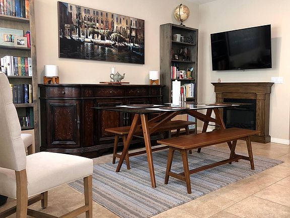 This space next to the kitchen can be used as a dining area or living room.