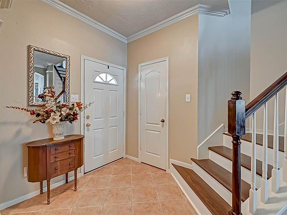 Your foyer with floor tile and coat closet to the left.
