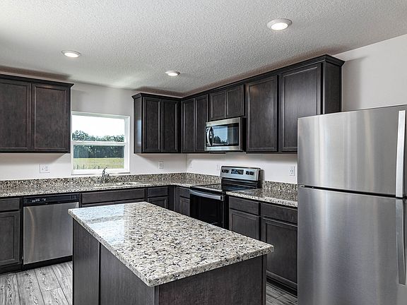 This move-in ready home features gorgeous granite countertops in the kitchen
