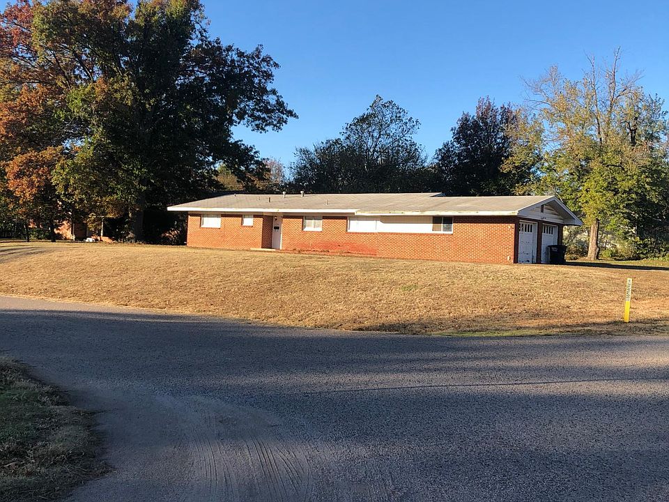 Home sits on a hill on large corner lot at Bell and Cammack.