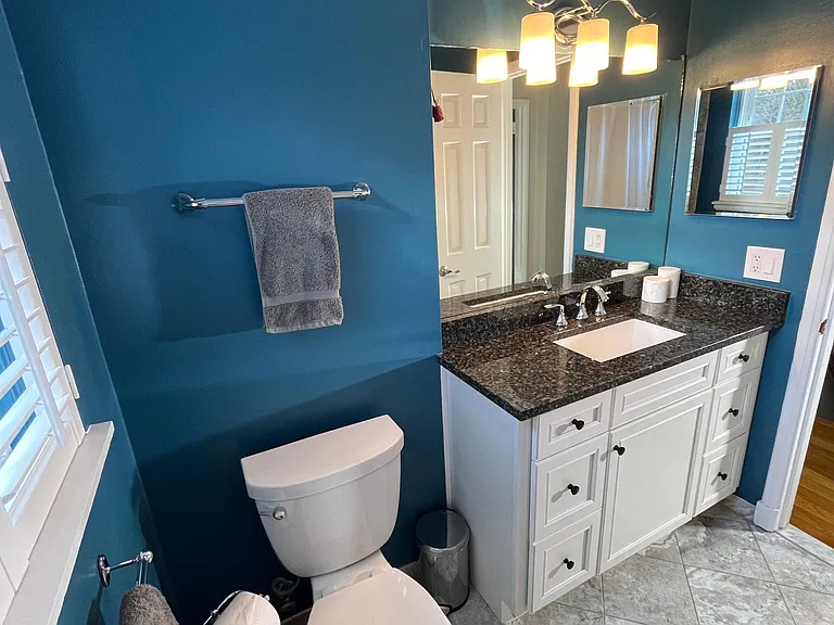 Primary bathroom - granite vanity with soft close drawers.