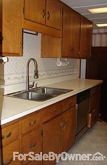 Bathroom
						:
						Bathroom with skylight and wood cabinets for storage.