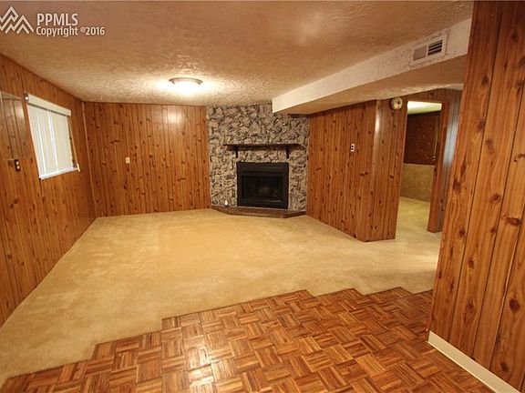 Lower level family foom with Wood-Burning Fireplace.