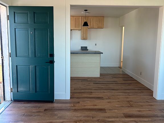 The front living room is large with a large closet. Just past the door is a dining area and then the kitchen. Nice open layout.
