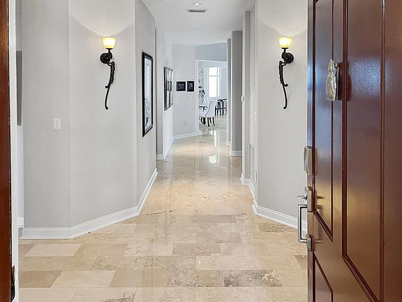 Welcome home! Notice the beautiful travertine floors and 10' ceilings.