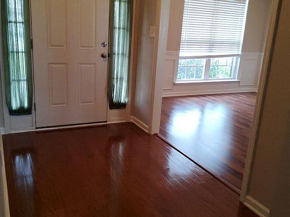 Upgraded Flooring and Finishes: Hardwood floors throughout the main living areas, stylish fixtures, and a modern aesthetic give the home an upscale, polished feel.