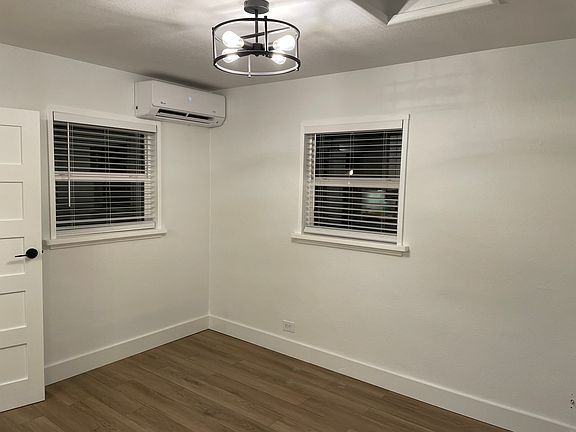 Living room with sky light and mini split heating and cooling.