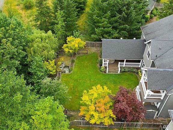 Park like backyard with total privacy.  Covered deck with outdoor kitchen. there are 3 covered decks!