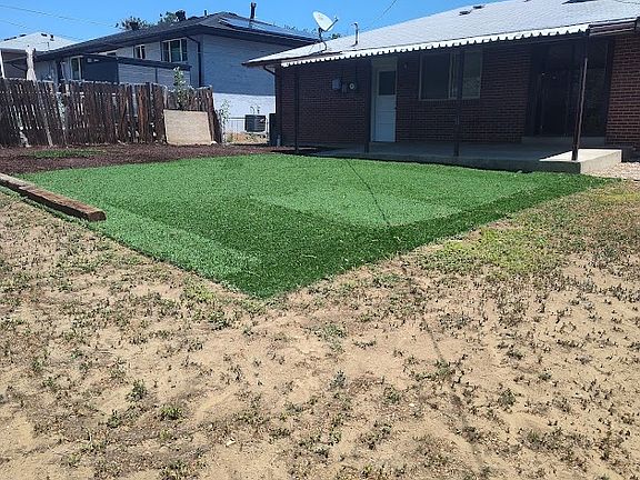 Some artificial grass in back yard
