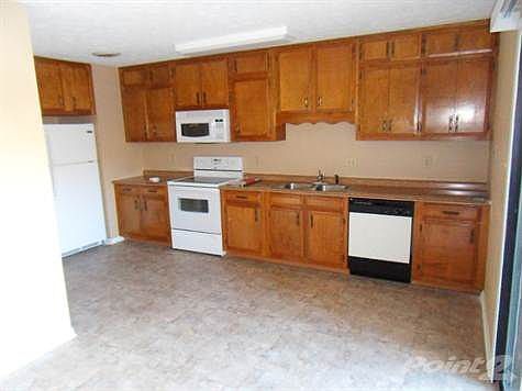 Kitchen with new fridge and stove