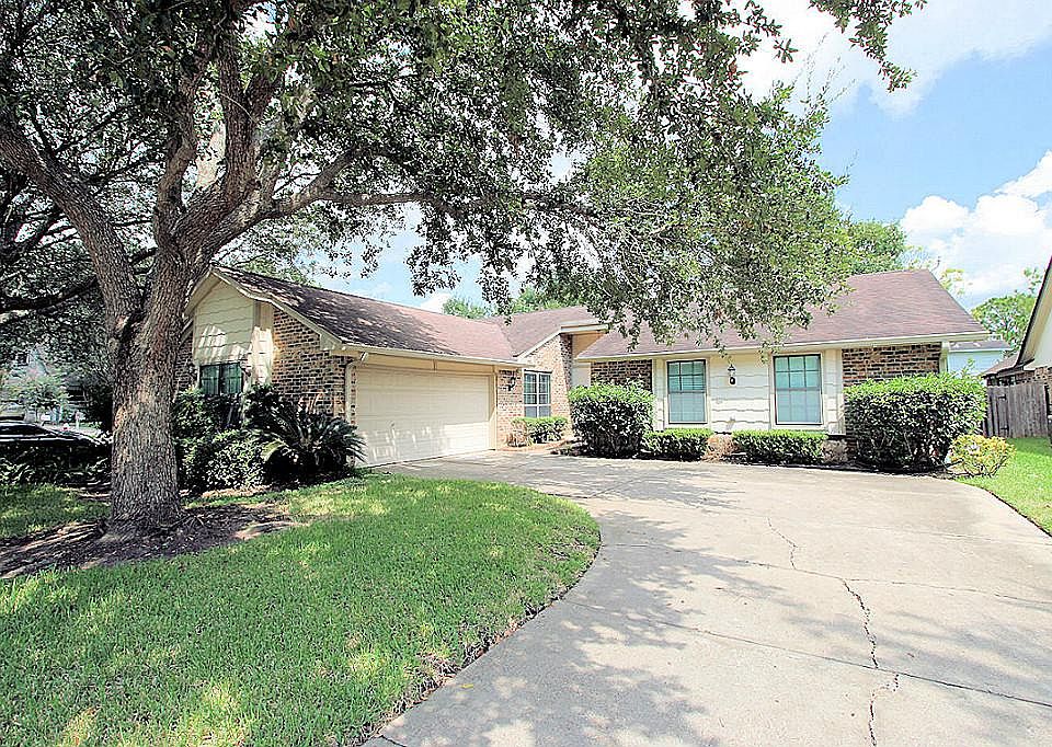Gorgeous front elevation with mature shade trees on a cul-de-sac location.