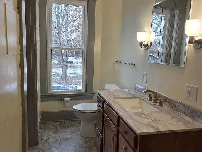 Bath inside the master bedroom looking at the front window and vanity.