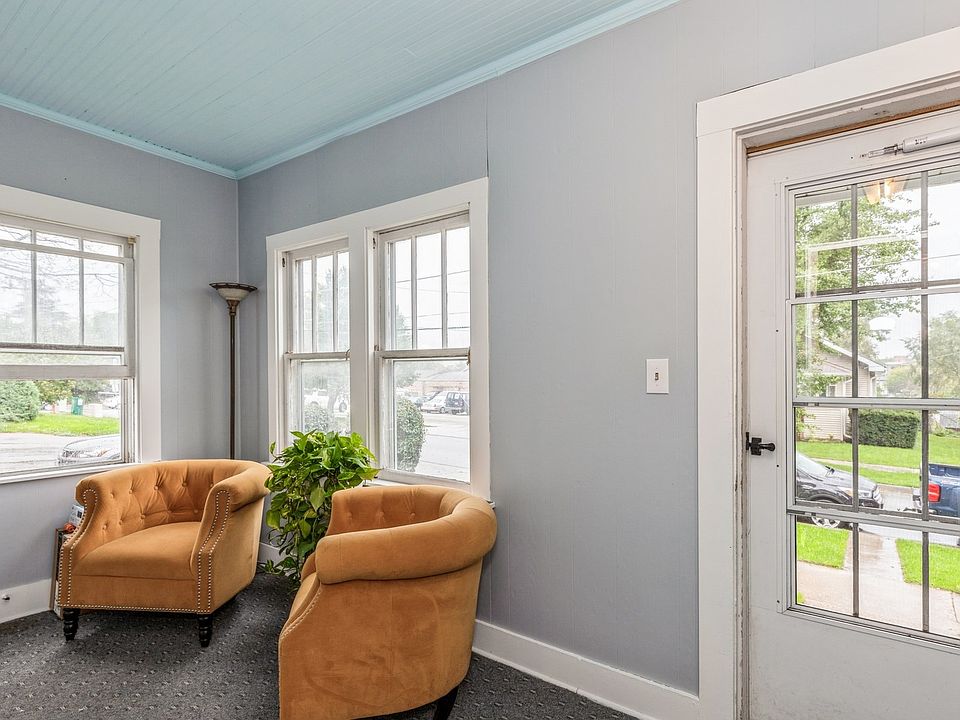 Enclosed porch for access to both units.