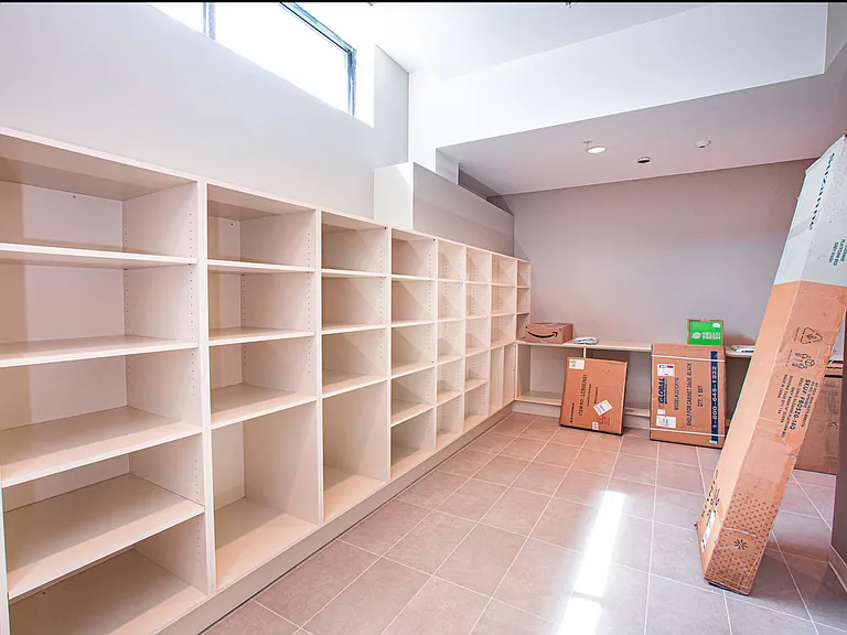 Secured large mail room for oversized packages