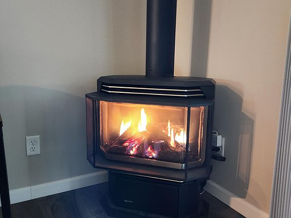 Gas fireplace heats the entire home. Stay warm and cozy during the colder months.