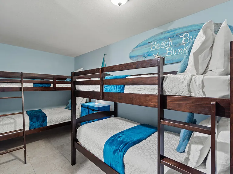 The last bedroom is a bunk room with two sets of twin-over-twin bunk beds, perfect for kids.