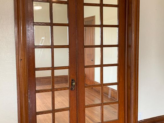 French doors separating living space from bedroom