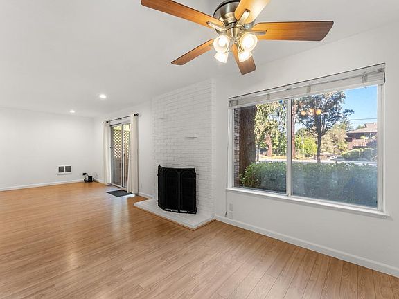 Cozy living room and Dining Area with a wood-buring fireplace