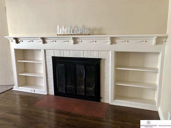 So much charm with this wood burning fireplace and mantle with built-ins