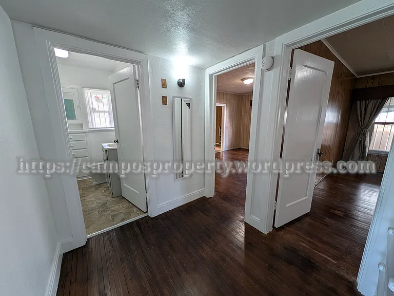 Hallway with original custom built-in cabinets.