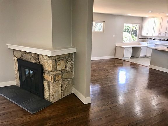 Wood burning fireplace between family room and living room