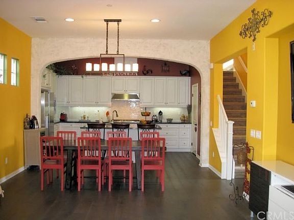 Plenty of room for formal dinners in the dining area of the great room. Textured faux finish adds in