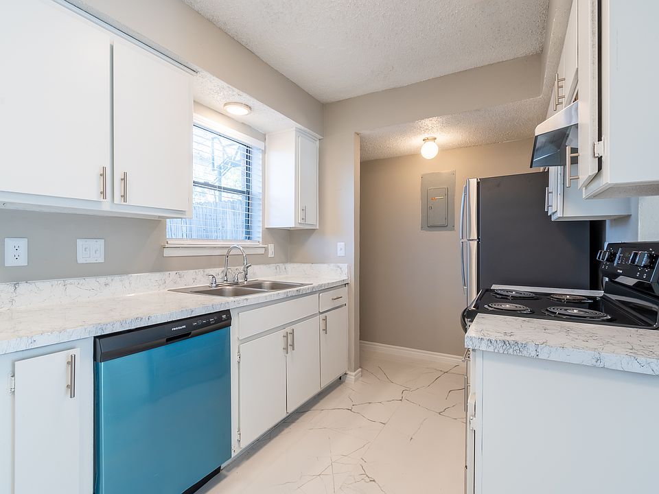 Well-equipped kitchen with modern appliances, generous counter space, and efficient layout for easy meal prep.