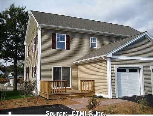 Rear view garage and 10x10 deck off kitchen