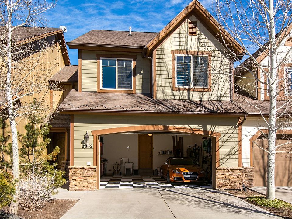 2 car garage with laundry sink and car vac