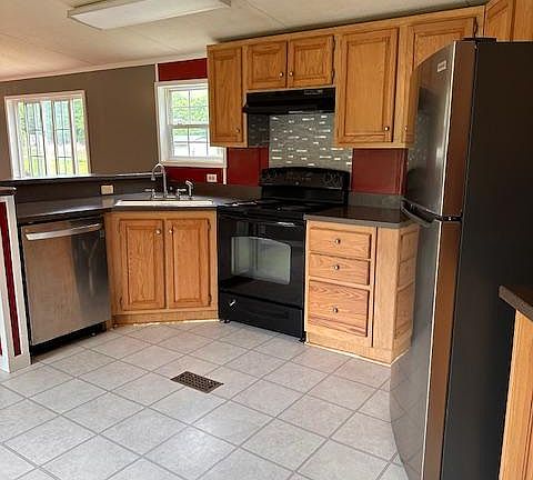 Dishwasher, stove, fridge, deep sink.