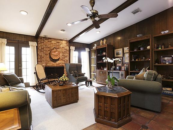  FAMILY ROOM (DEN) IS 22 ' X 16', HAS FRENCH DOORS OPENING TO SIDE PATIO.  BEAMED CEILING, BRICK SURROUND ON GASLOG FIREPLACE MAKE THIS A COMFORTABLE OASIS.