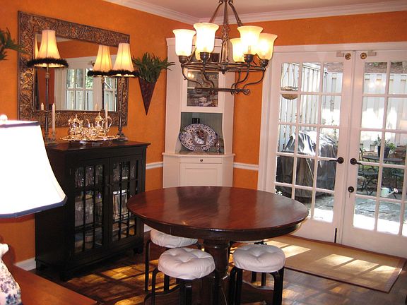 Lively dining room with french doors leading to private patio