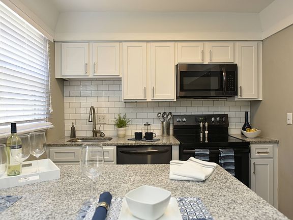 Kitchen with Backsplash + Modern Cabinetry