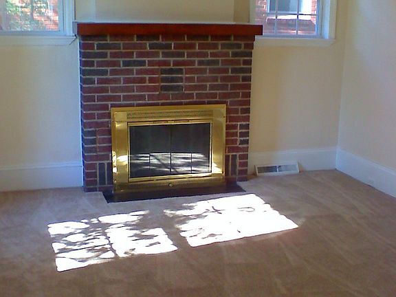 Living room, new windows, new paint, carpet, ceiling fan