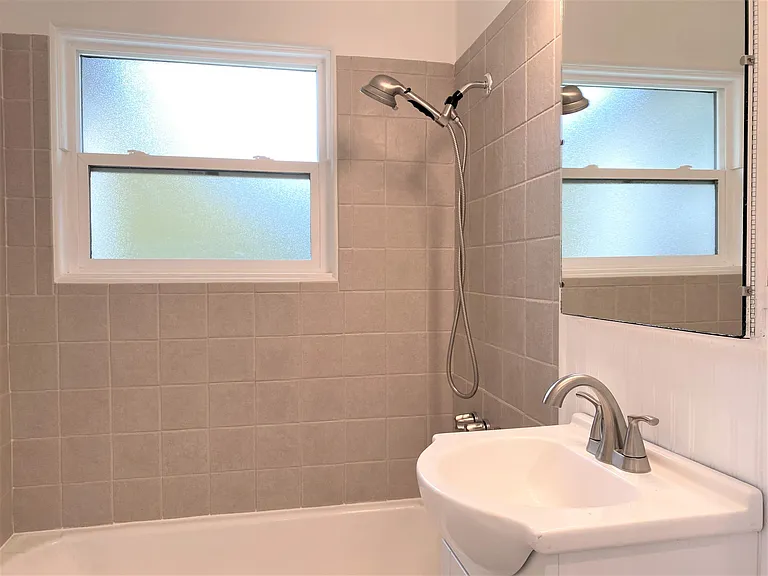 Full bath with shower on main floor.