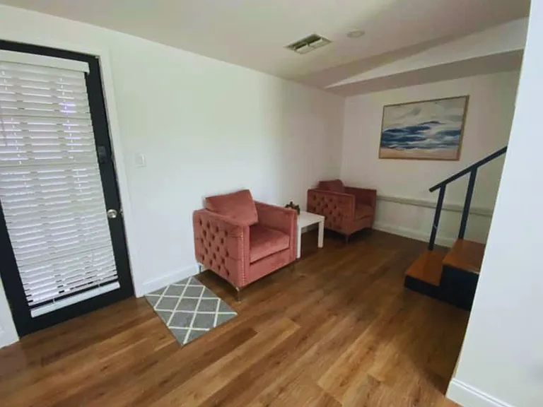 Two inviting armchairs and a coffee table create the perfect relaxation spot.
