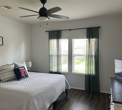 Primary bedroom located on floor level.