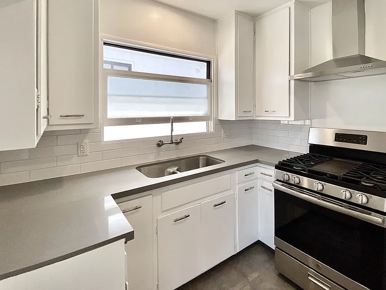 The updated kitchen is bright and well-appointed.