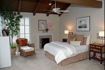 Large master bedroom with fireplace.