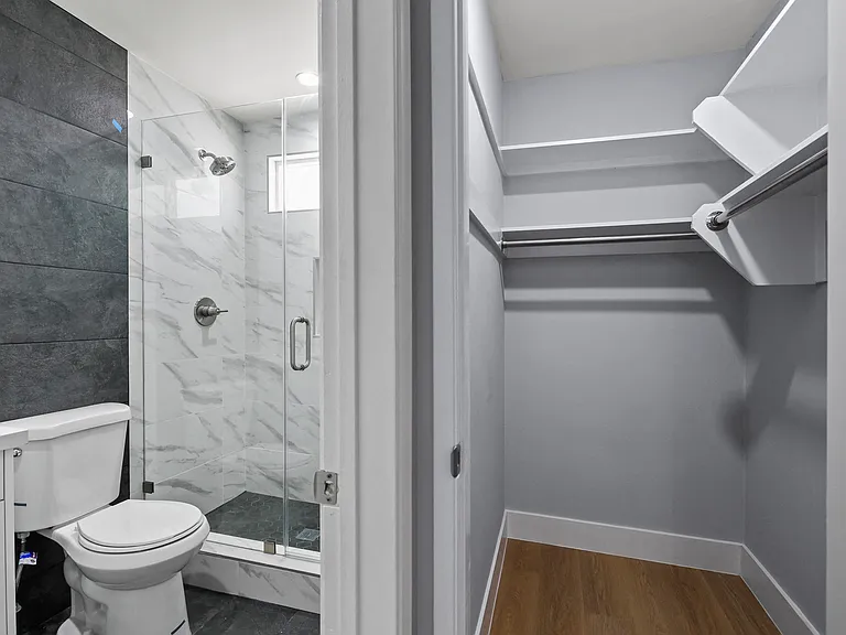 Bathroom with Walk-In Shower and Closet with Shelving