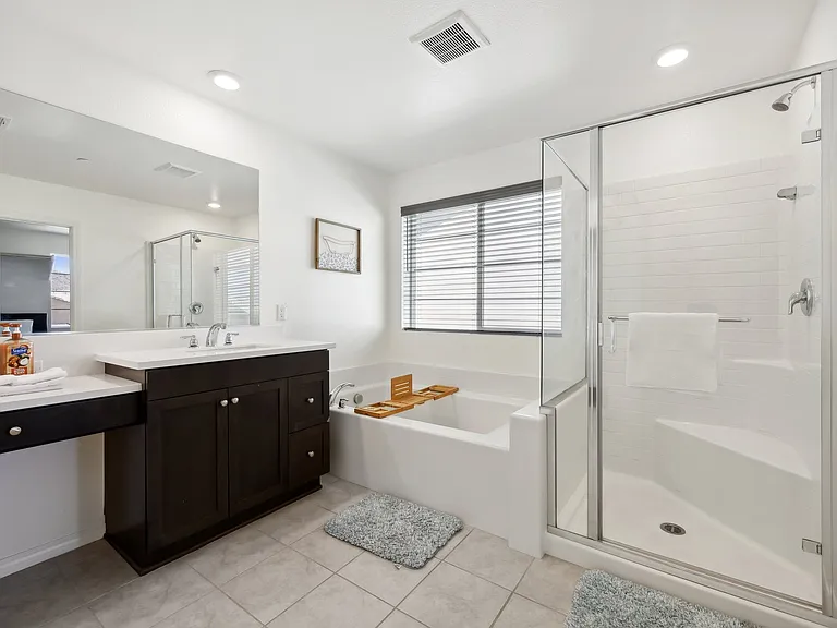 Step into comfort with a spacious walk-in shower for a refreshing experience.