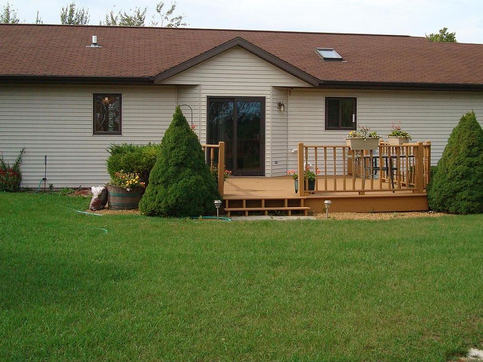 back of house with deck