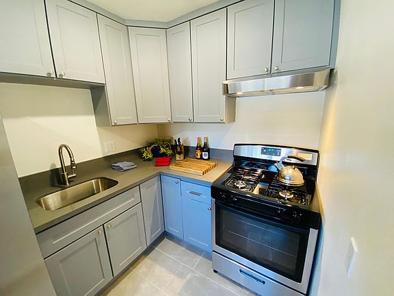 All new stainless steel kitchen includes quartz countertops, stainless sink, refrigerator and ice-maker. Shaker style cabinets are quiet-close.