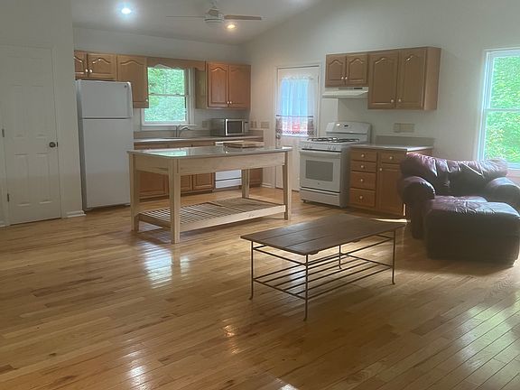 The living dining & kitchen are all one great big room. High ceilings give the space a very open feeling