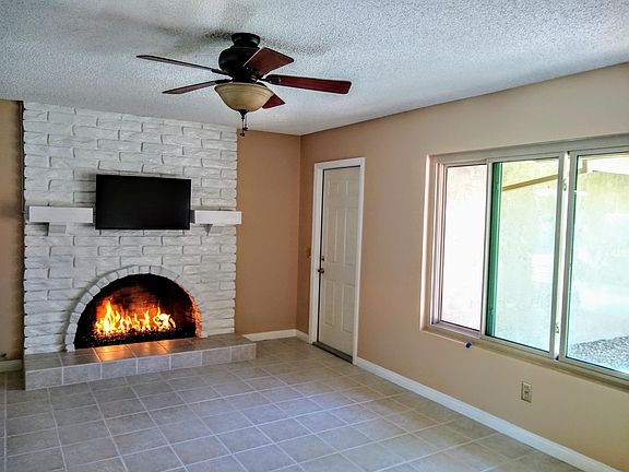 Den gas fireplace with glass rock