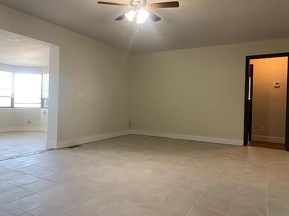 Living room to bedrooms and main bath. New tile floor
