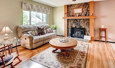 Beautiful Moss Rock Fireplace with Custom-Built Wood Hearth