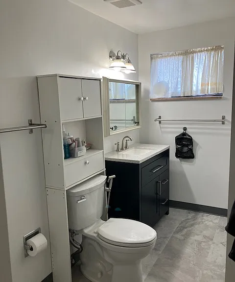 Fully renovated bathroom with new shower, vanity and flooring